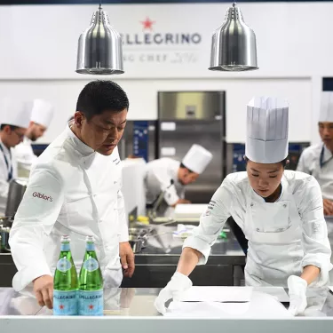Chef teaching to a young talent in S.Pellegrino Academy